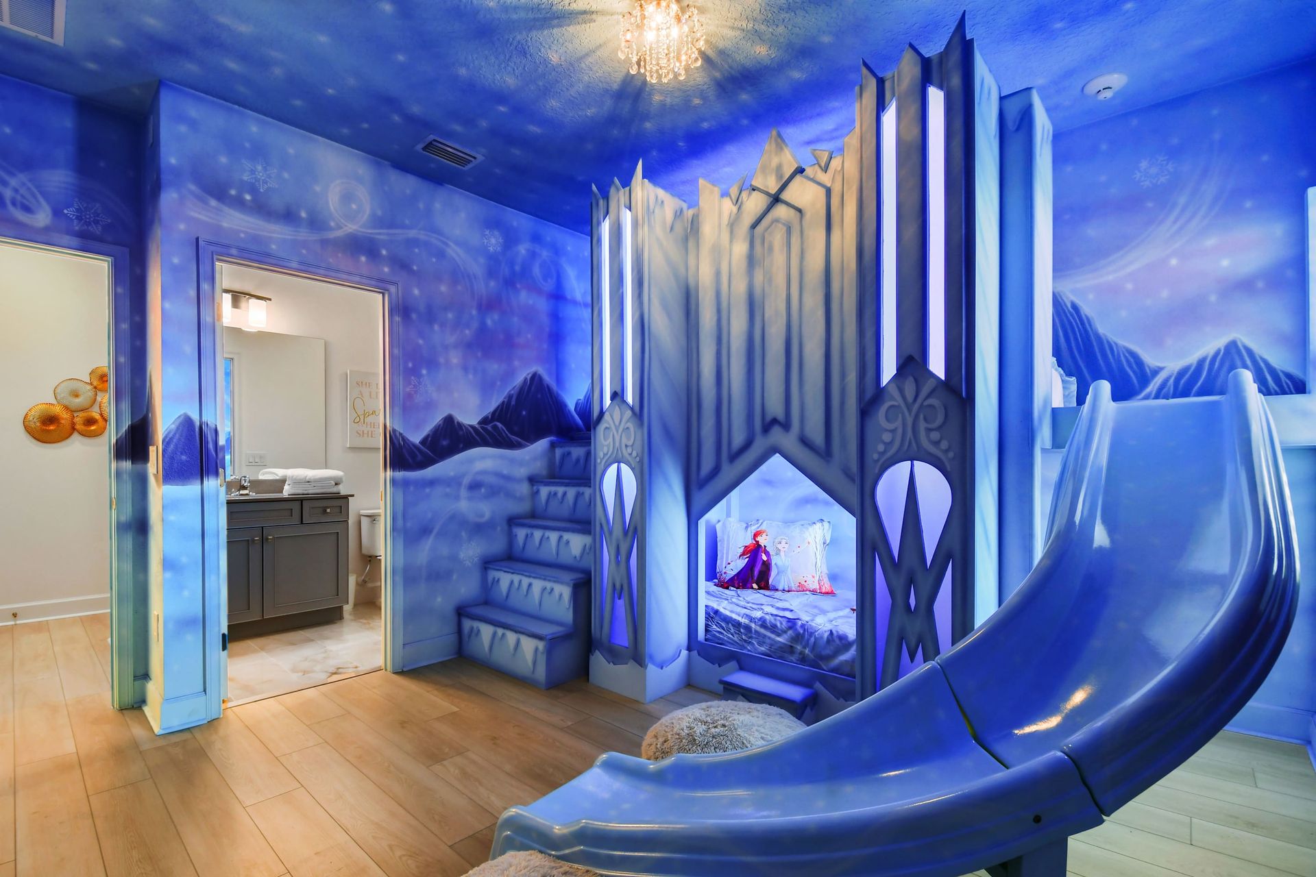 Magical Frozen-themed kids room with castle bunk, icy slide, and winter dreams.