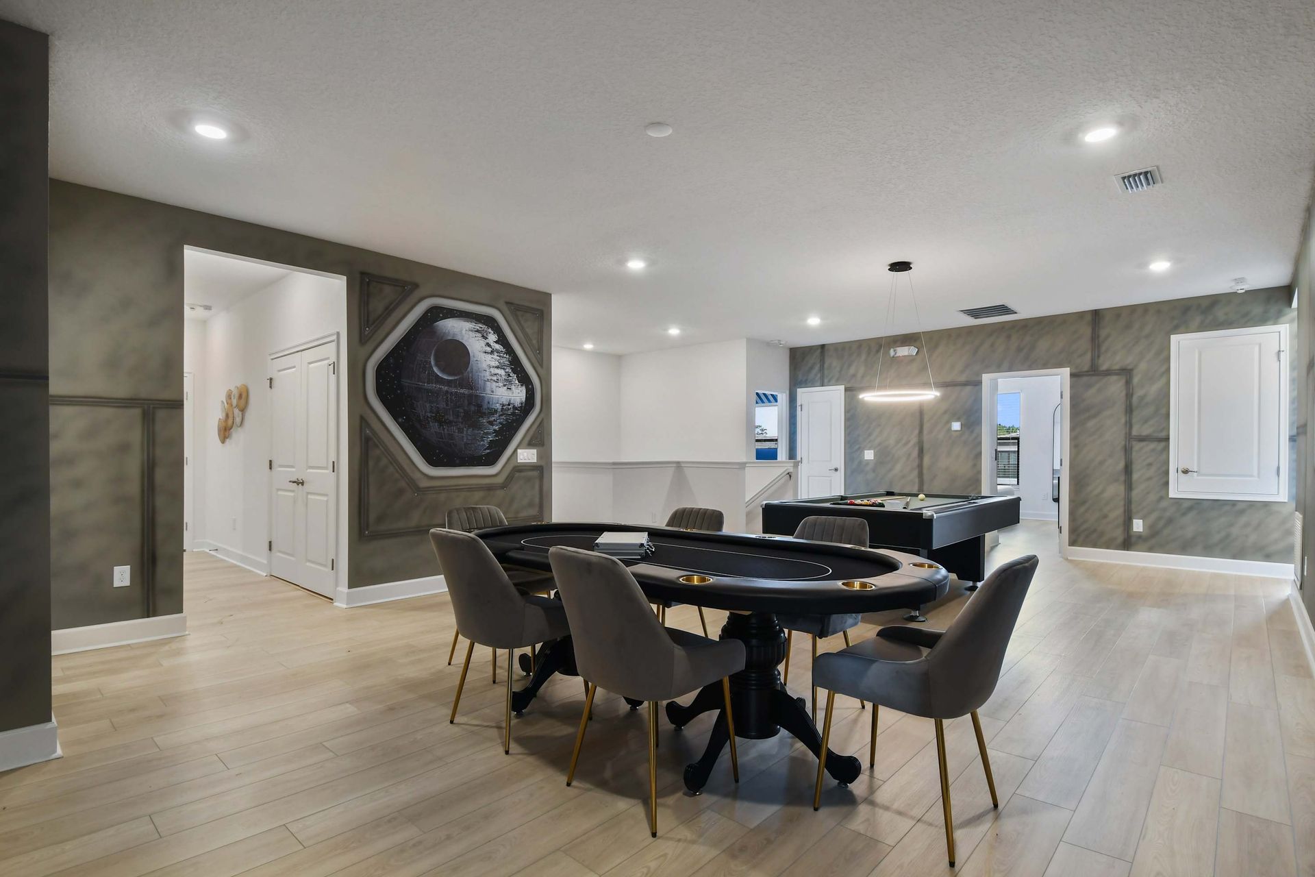 Epic game room with poker, pool, and Star Wars vibes for ultimate fun.