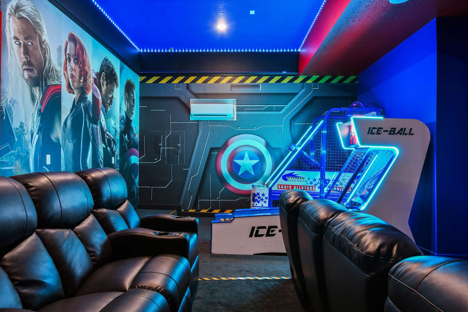 Avengers-themed theater with arcade games and luxury recliners for epic nights.