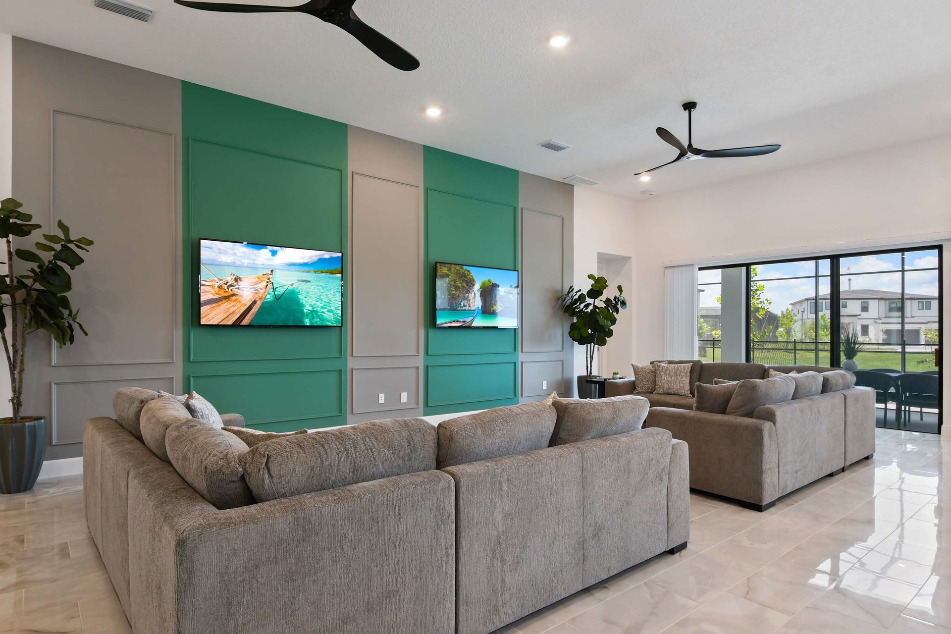 Spacious modern living room with dual TVs and plush seating for ultimate comfort.