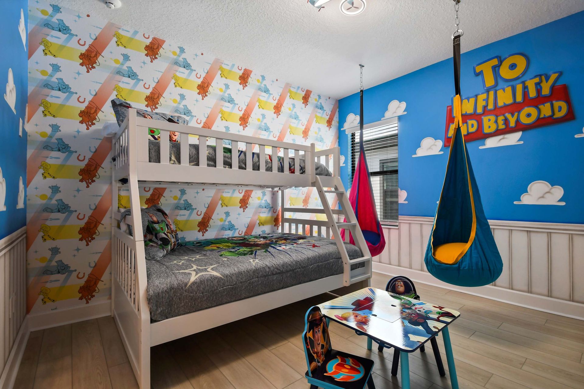Toy Story-themed bunk room with swings, playful decor, and space to dream big.