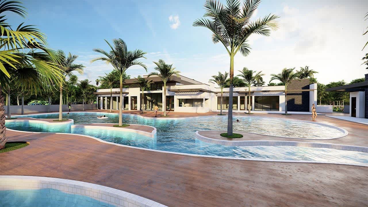 Resort-style pool with palm trees, lounge areas, and luxury clubhouse access
