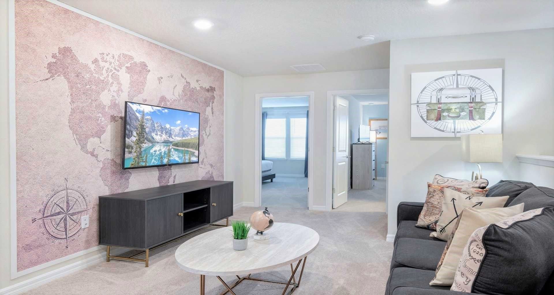 Relaxing lounge area featuring a TV, providing a comfortable space for entertainment.