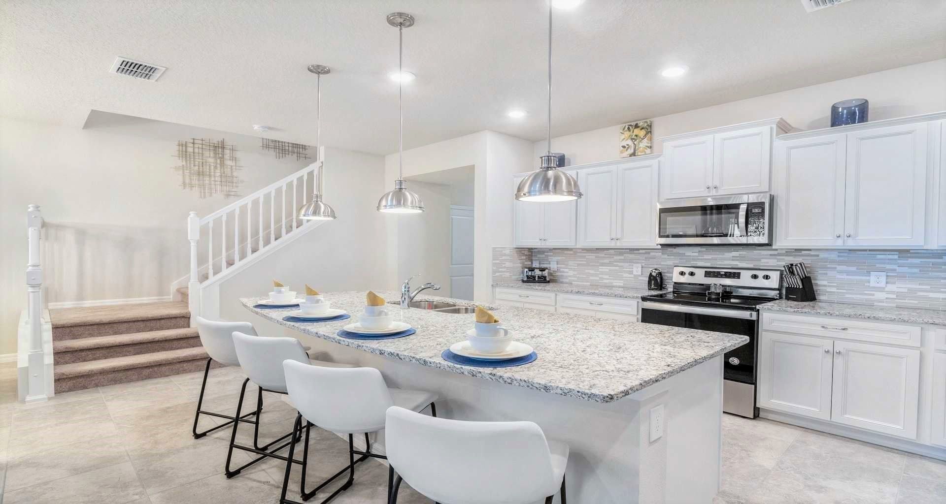 The spacious chef's kitchen is fully equipped with all the essentials, ensuring a well-appointed and functional space for culinary enthusiasts