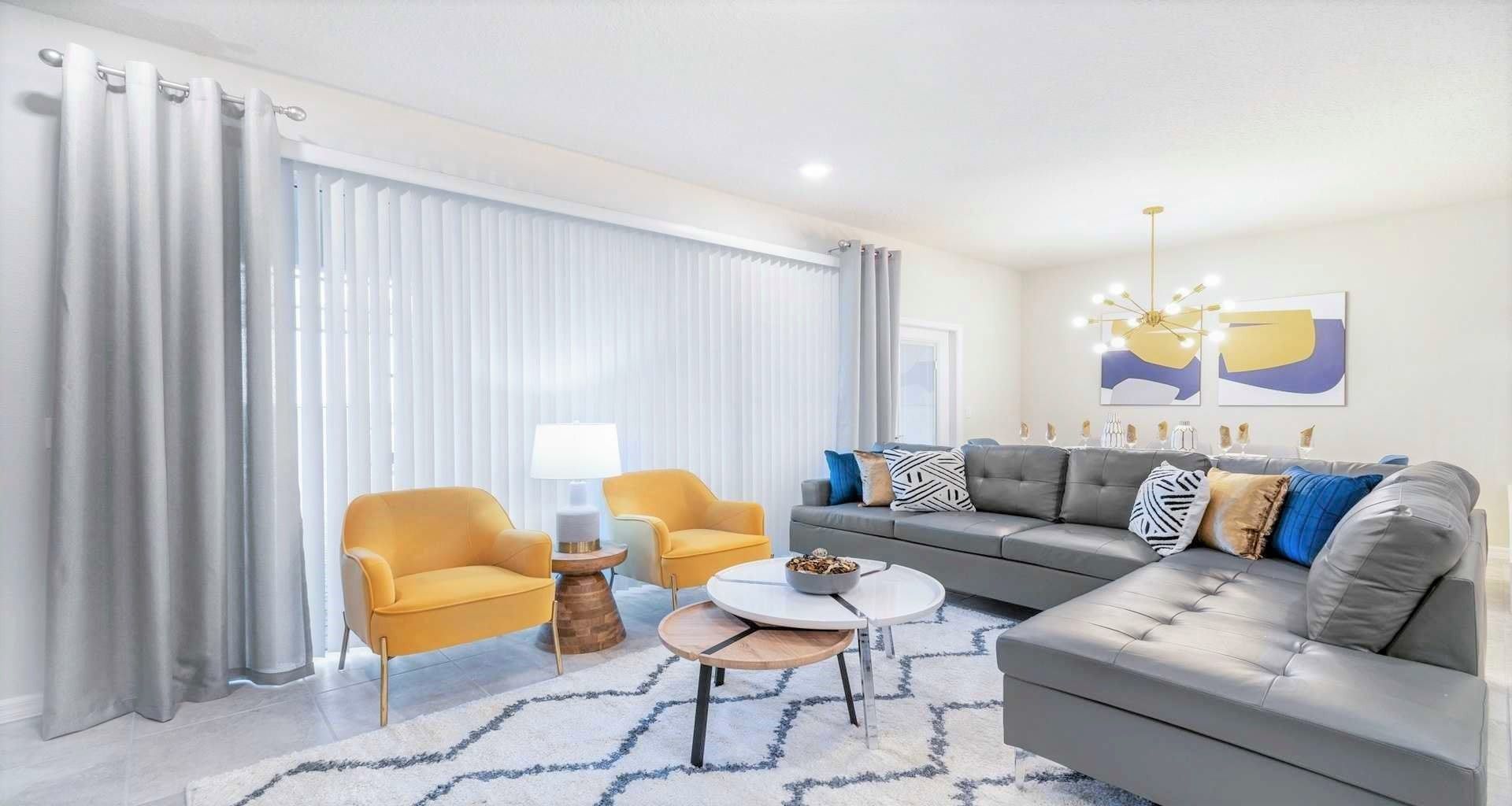 Expansive and inviting living room, designed for comfort and warmth, providing the ideal space for creating cherished memories.