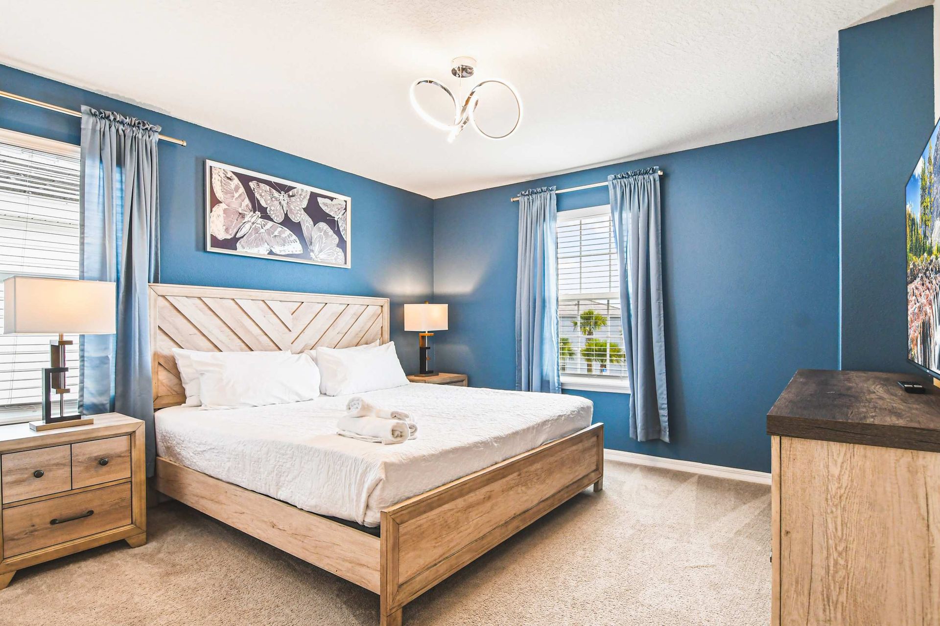 Sleek and serene: Dive into tranquility in this stylish blue bedroom, perfect for unwinding and dreaming big.