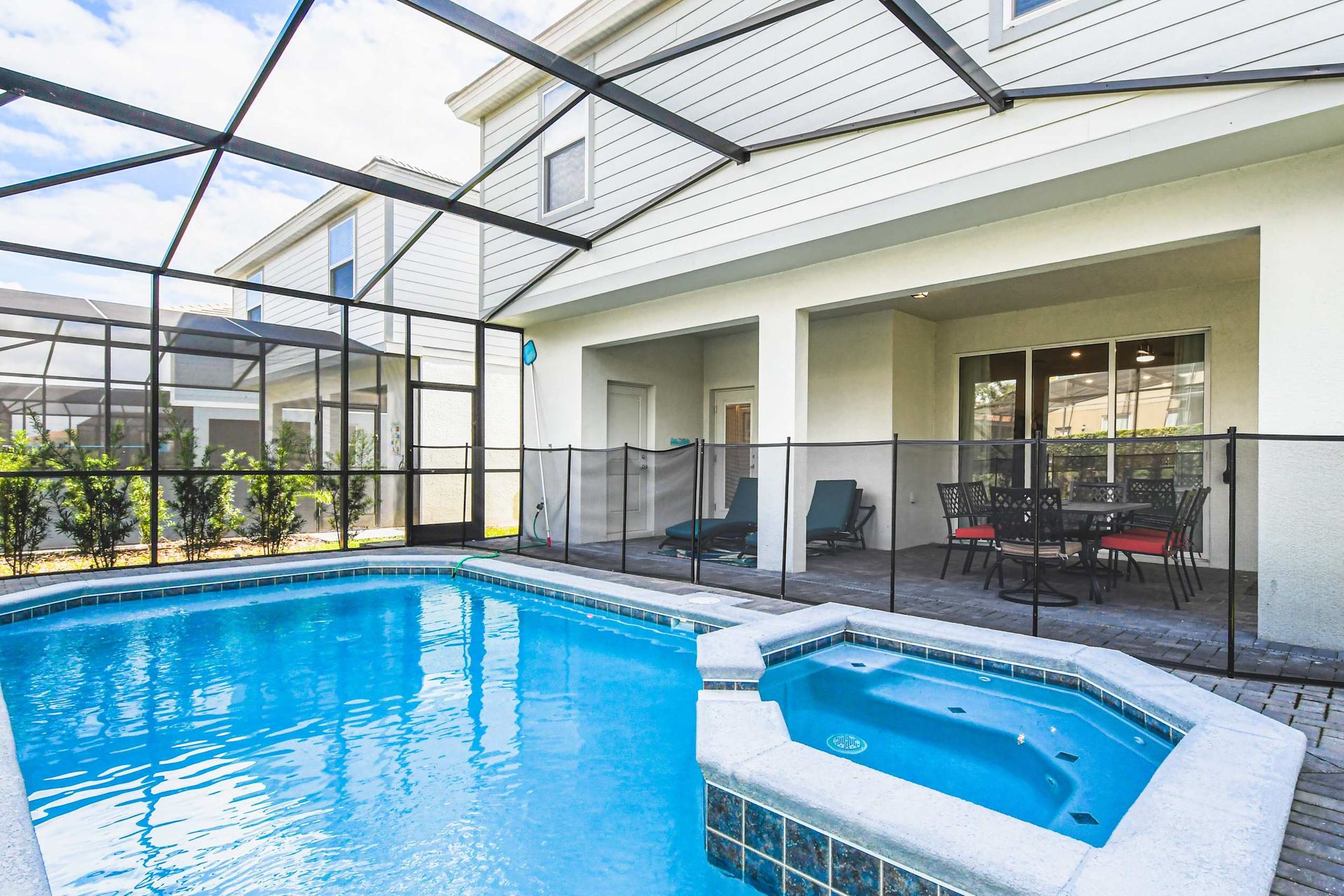 Escape to your private paradise with this stunning screened pool and spa, perfect for soaking up the sun in style!