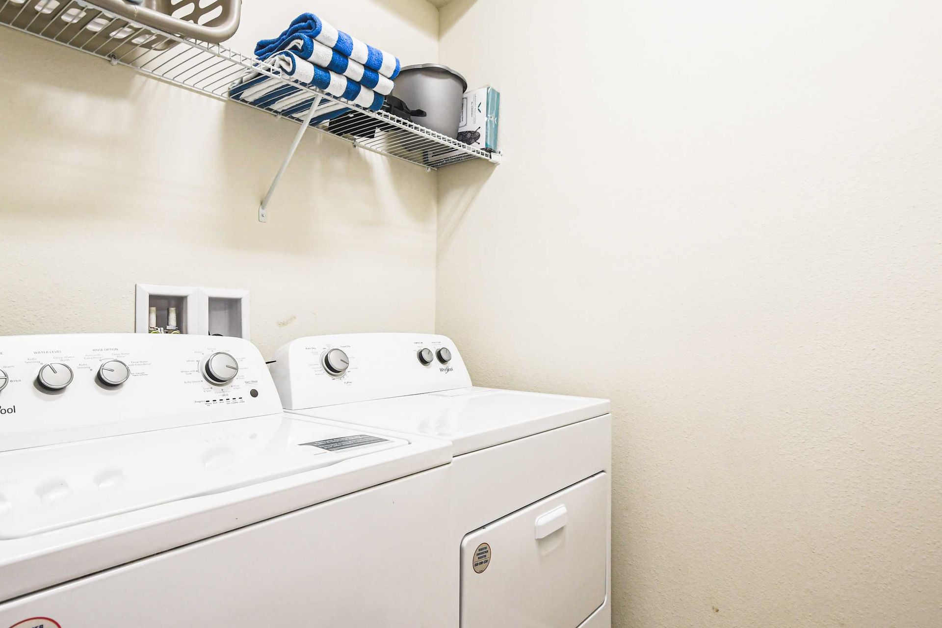 Efficient and compact laundry room equipped with everything you need to make washing day a breeze!