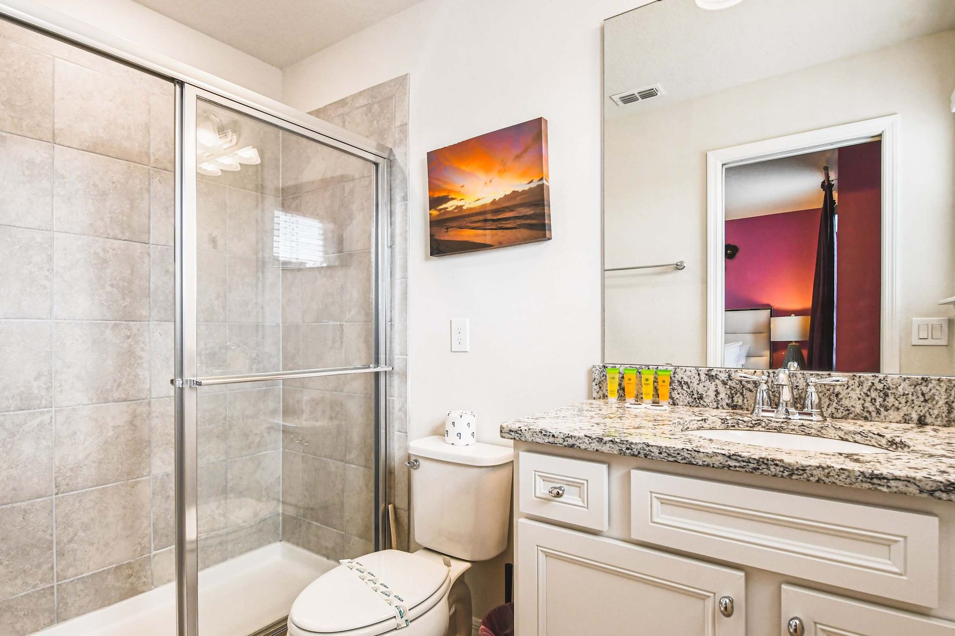 Chic bathroom with stylish accents and spacious vanity, offering a touch of luxury and perfect lighting for pampering!