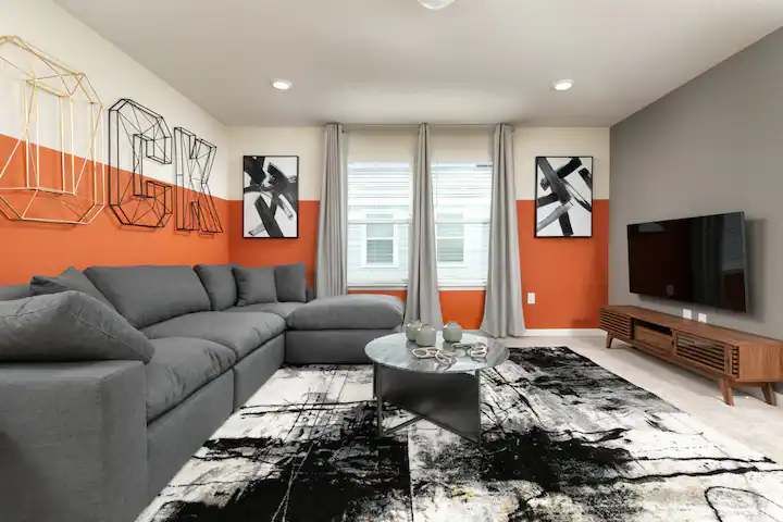 Chic loft with bold accent walls, stylish decor, and a plush sectional for relaxing.