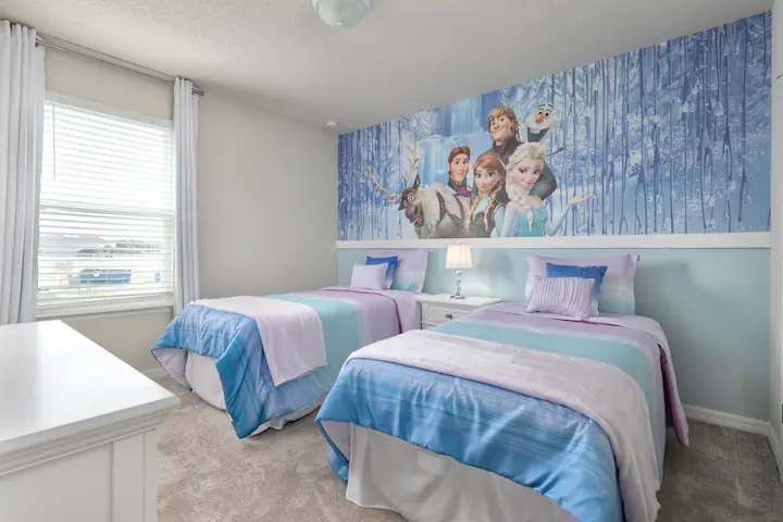 Magical Frozen-themed bedroom with twin beds, perfect for little adventurers.