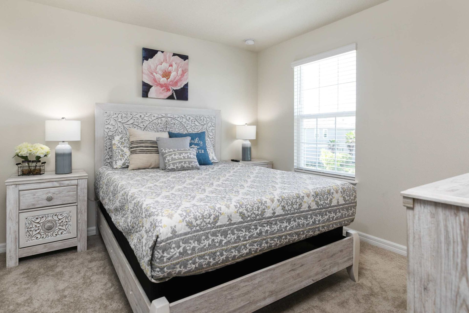 Sophisticated bedroom retreat blending ornate craftsmanship with a tranquil, light-filled ambiance.