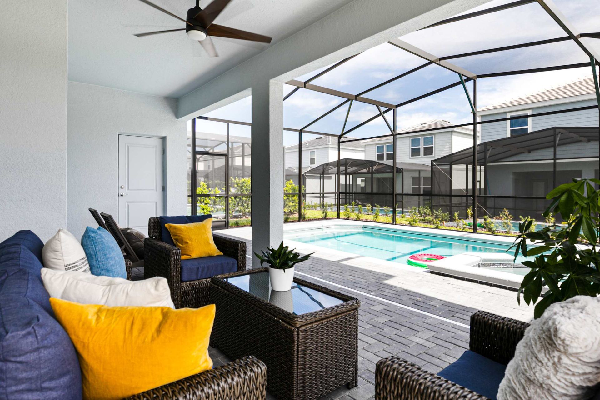 Experience seamless indoor-outdoor luxury on this chic patio overlooking a private azure pool.