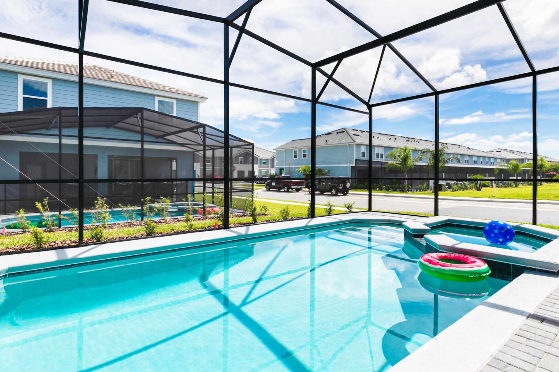 Bask in the sun-drenched elegance of this private screened-in pool oasis, your ultimate retreat.