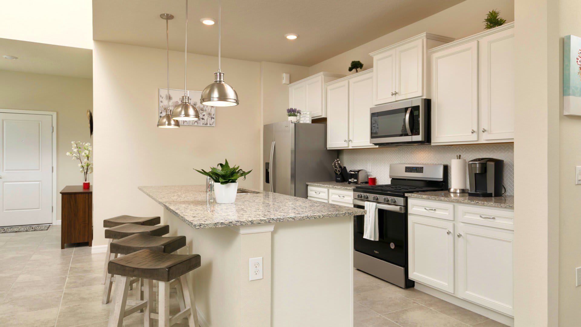 An island with a clean kitchen, cook your favorite meal here.