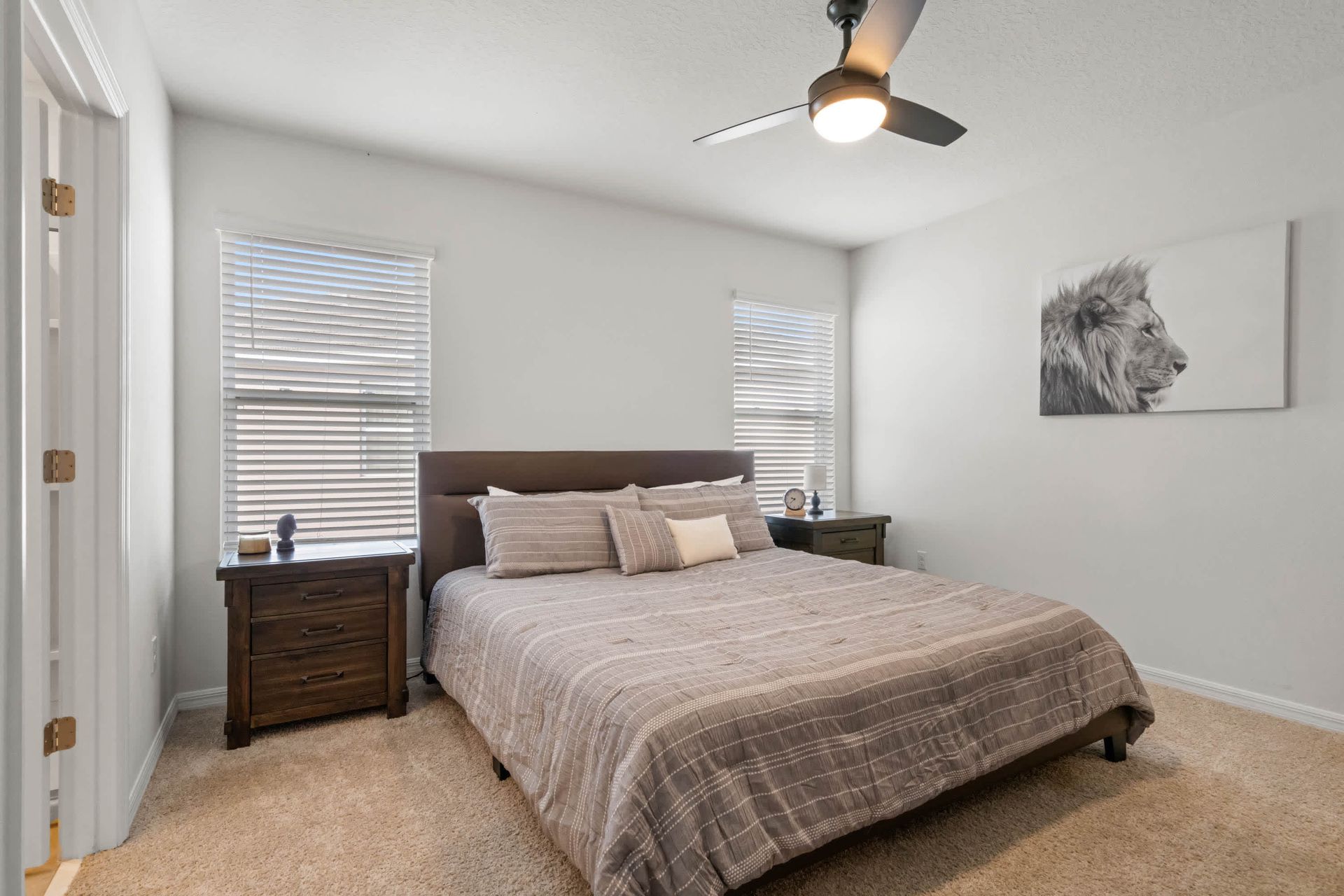 Tranquil bedroom with king bed, cozy earth tones, and rustic nightstands.