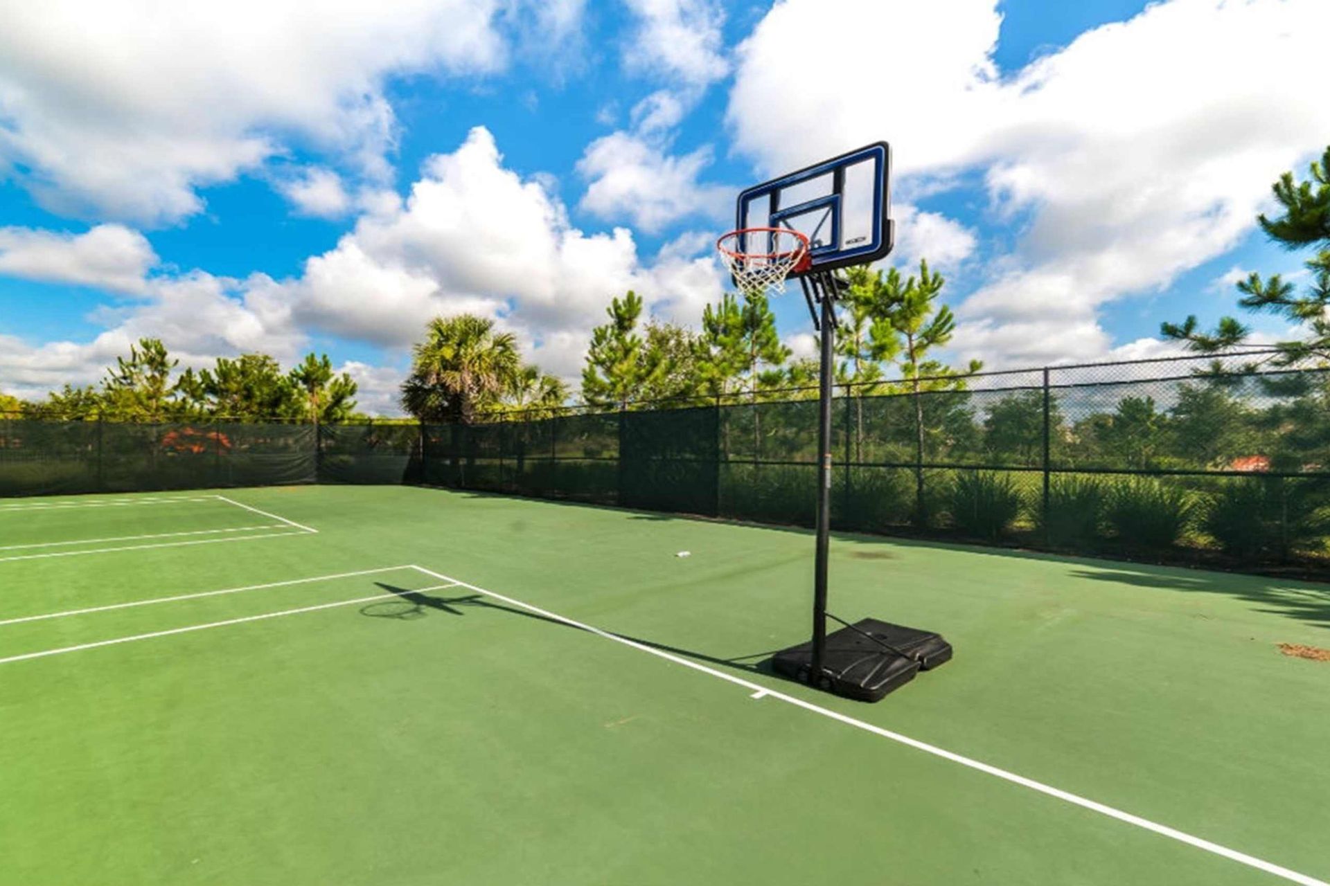 Challenge your friends to a match on the resort's tennis court, offering you a thrilling way to stay active and enjoy the outdoors during your stay.