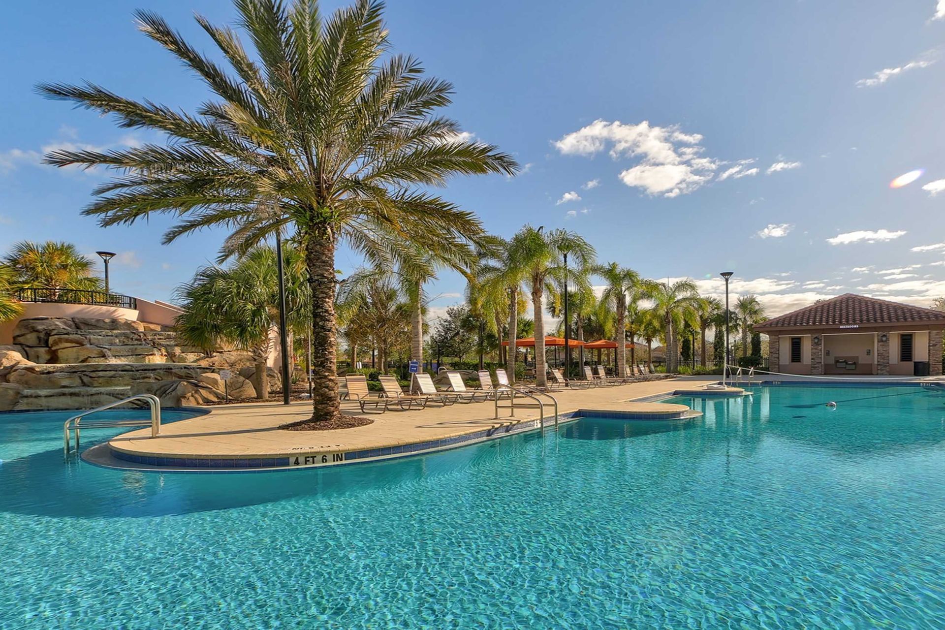 Indulge in ultimate relaxation as you float in the sun-kissed waters of the resort lazy pool, offering a serene retreat just steps from your door.