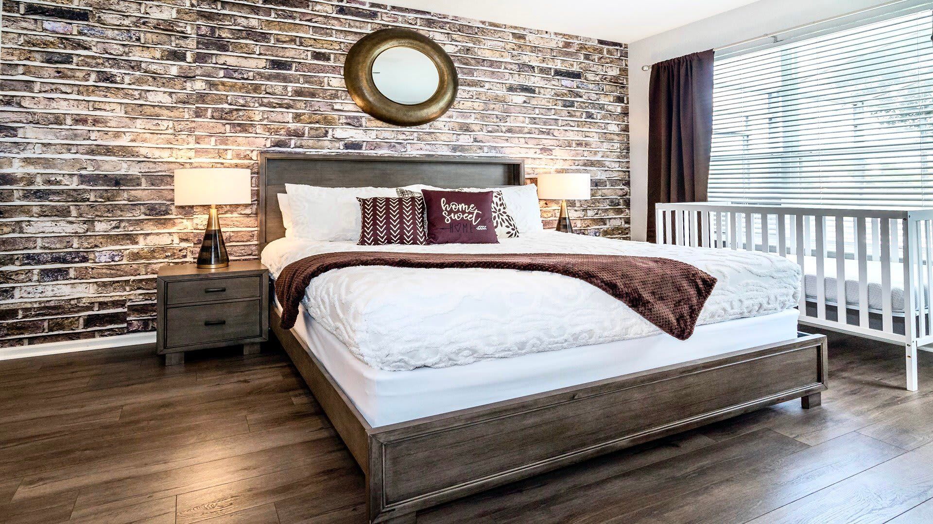 The master bedroom on the ground floor with a luxuriously large king bed