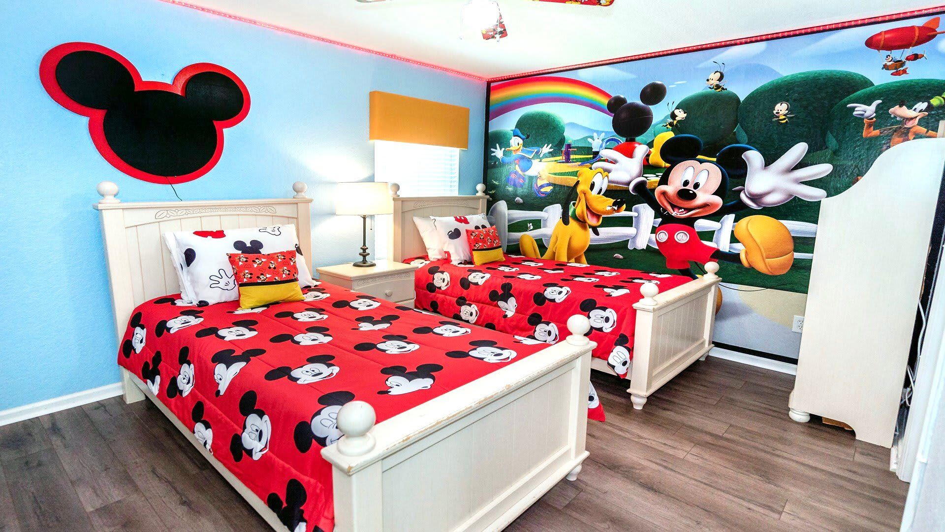 Enjoy the flexibility and comfort of our Mickey Mouse Themed room with two twin beds, providing you with a cozy and restful retreat during your stay.