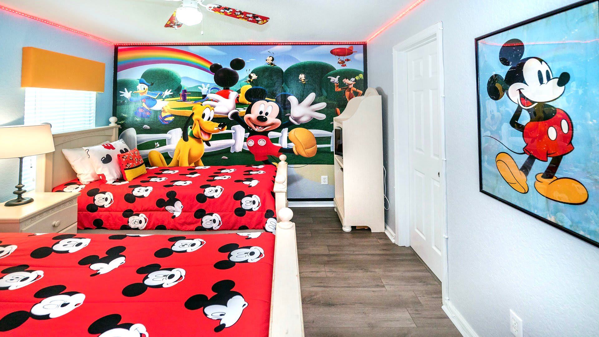 Experience a comfortable stay in our Mickey Mouse Themed room with two twin beds, offering you the perfect space to relax and recharge after a day of adventure.