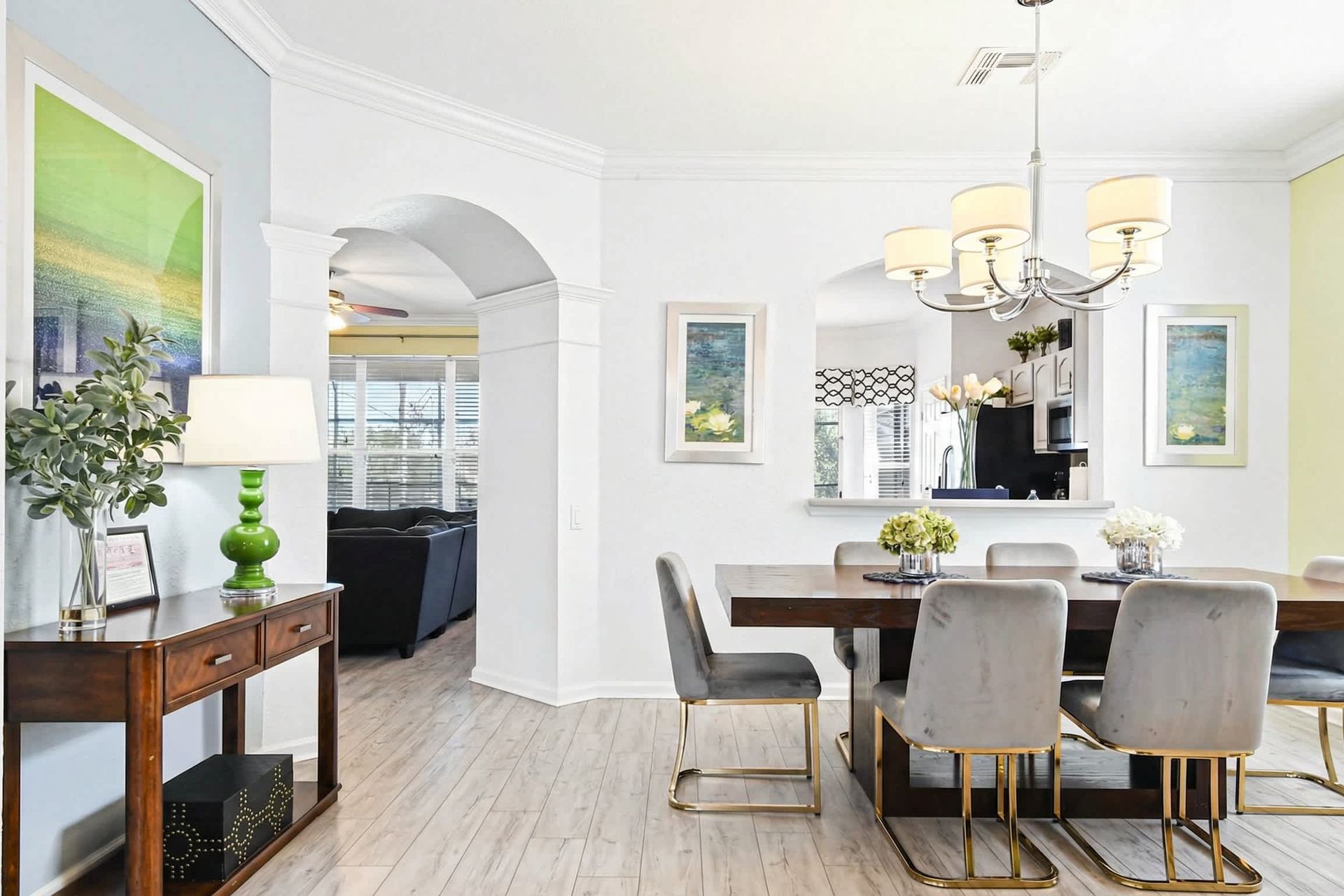 Elegant dining area with seating for eight, modern decor, and natural light.