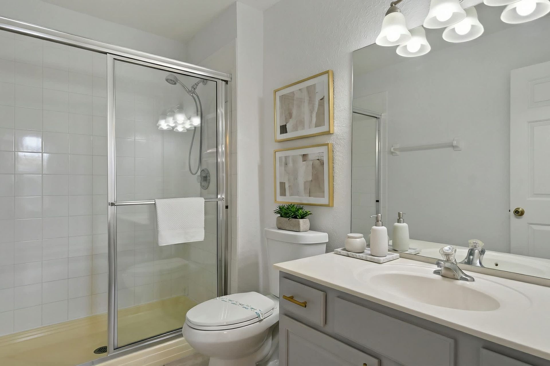 Clean and bright bathroom with a spacious walk-in shower and modern coastal décor.