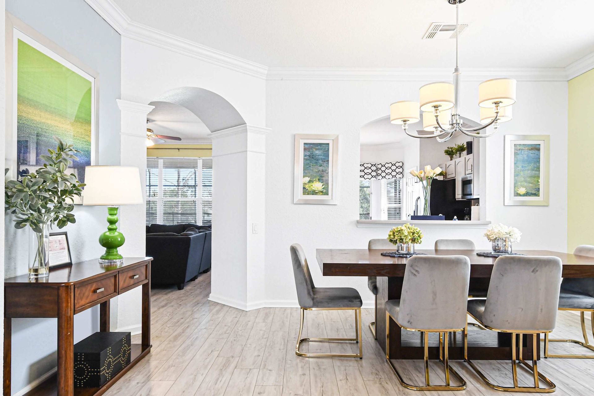 Elegant dining area with seating for eight, modern decor, and natural light.