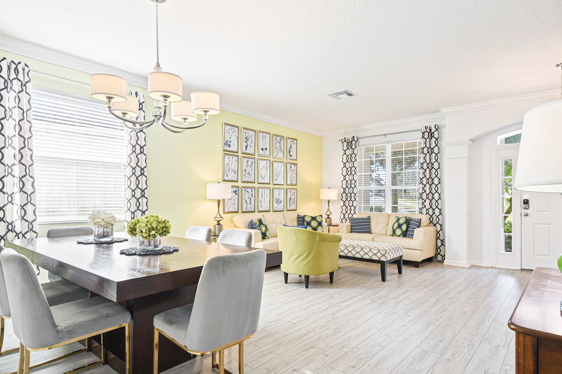 Open-concept living and dining with bright decor, stylish seating, and natural light.