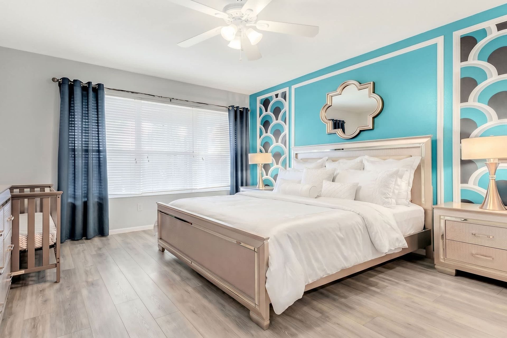 The master bedroom on the ground floor with a luxuriously large king bed