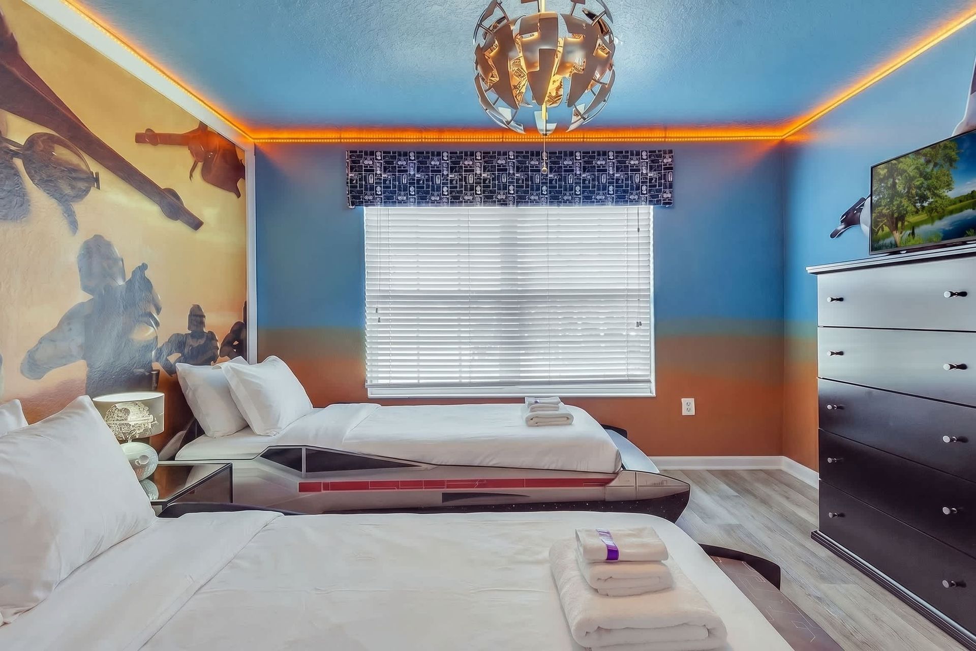 Unwind in our cozy Star Wars inspired room with two twin beds, providing you with a peaceful retreat and a restful night's sleep during your stay.