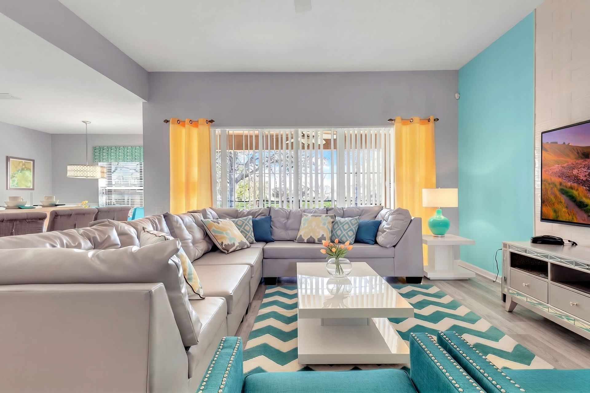 Spacious living room area with cozy sofa, perfect for family reunion.