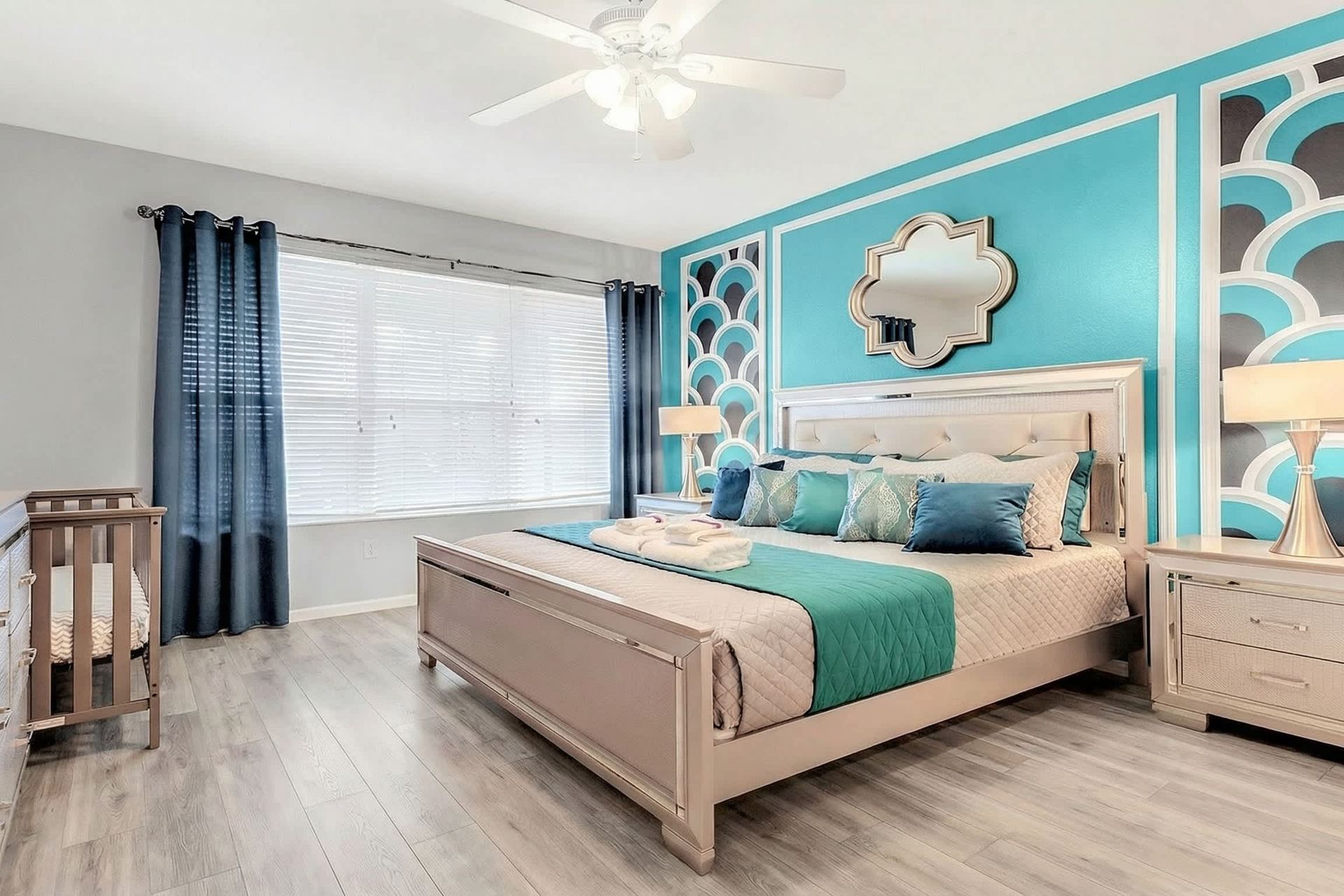 The master bedroom on the ground floor with a luxuriously large king bed