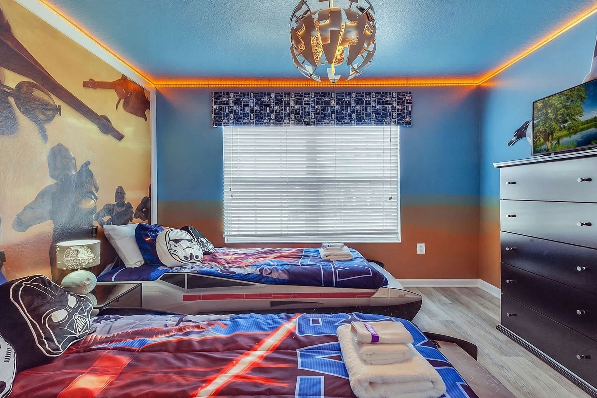 Unwind in our cozy Star Wars inspired room with two twin beds, providing you with a peaceful retreat and a restful night's sleep during your stay.