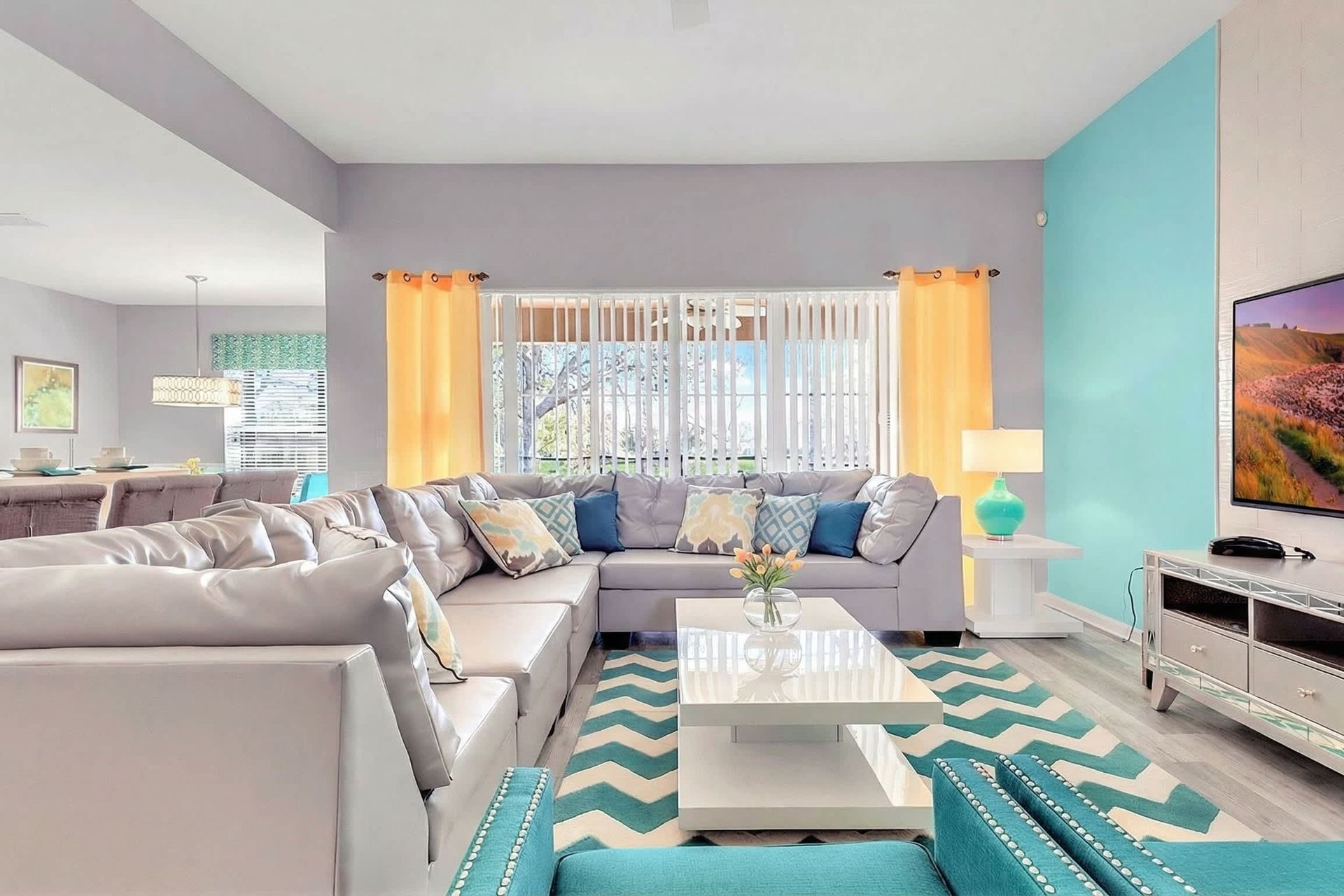 Spacious living room area with cozy sofa, perfect for family reunion.