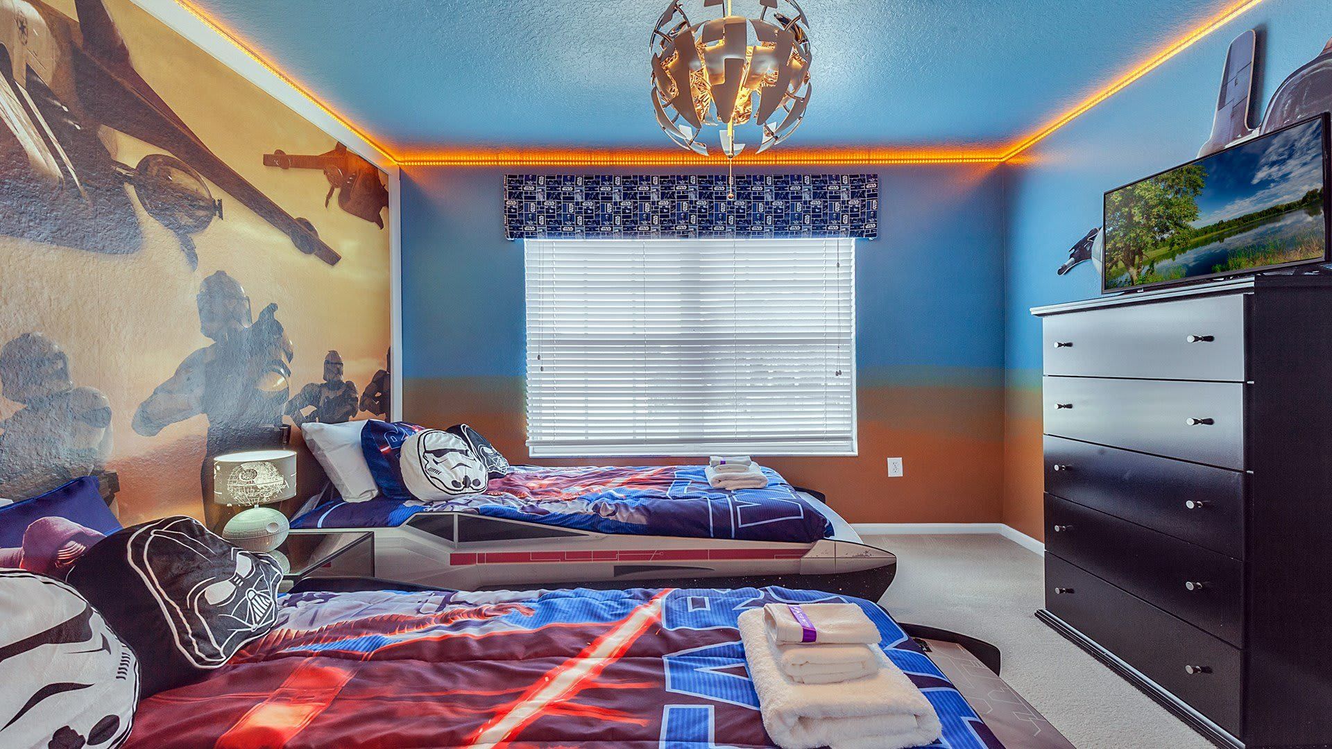 Unwind in our cozy Star Wars inspired room with two twin beds, providing you with a peaceful retreat and a restful night's sleep during your stay.