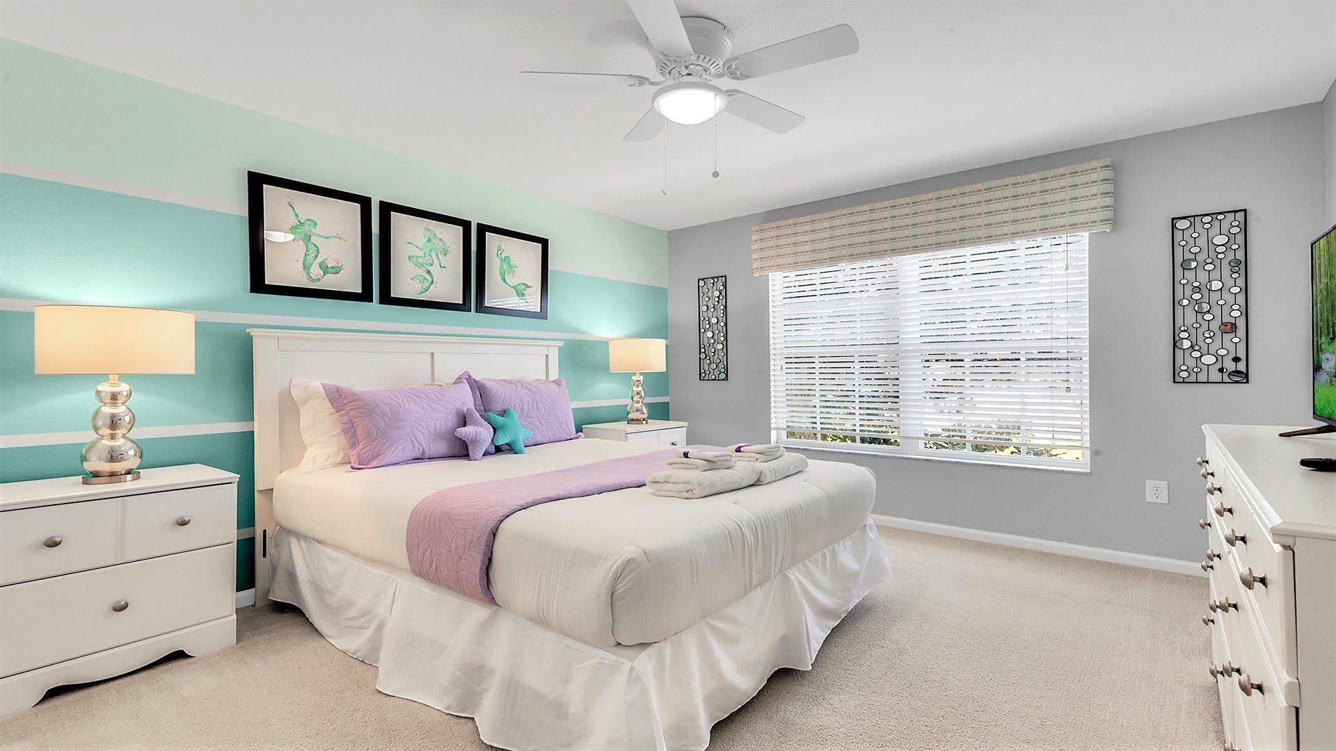 The spacious king bedroom with a Smart TV