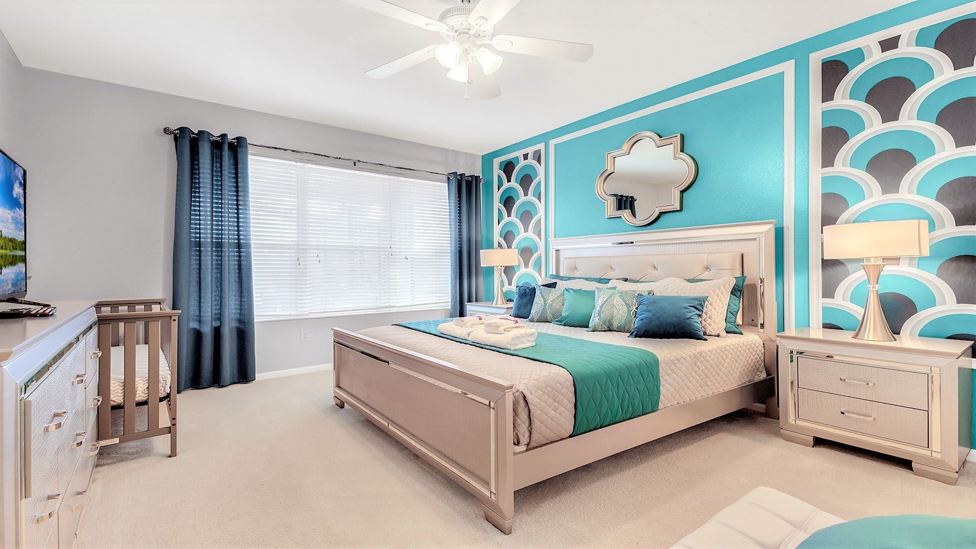 The master bedroom on the ground floor with a luxuriously large king bed