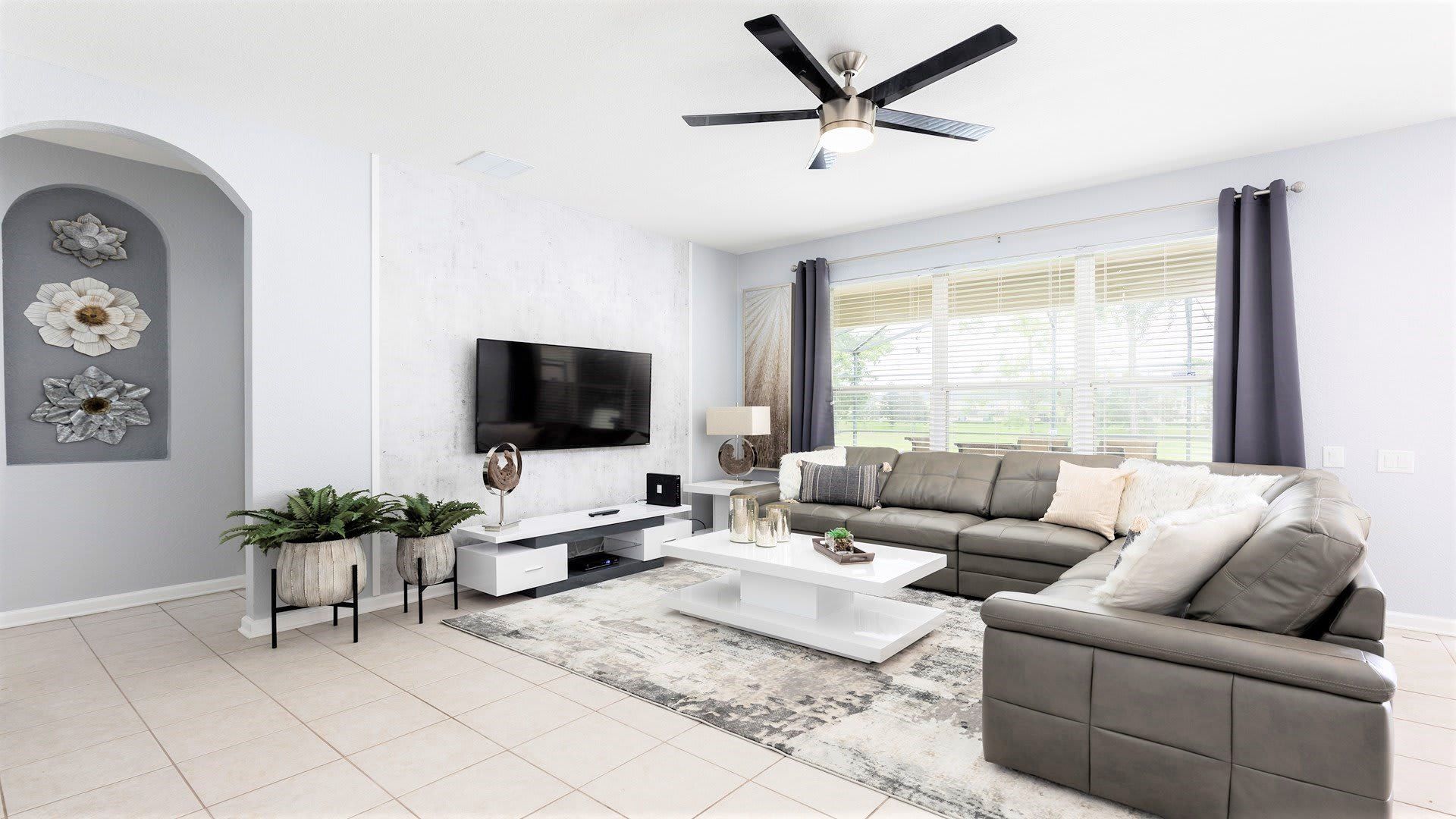 Spacious living room area with cozy sofa, perfect for family reunion