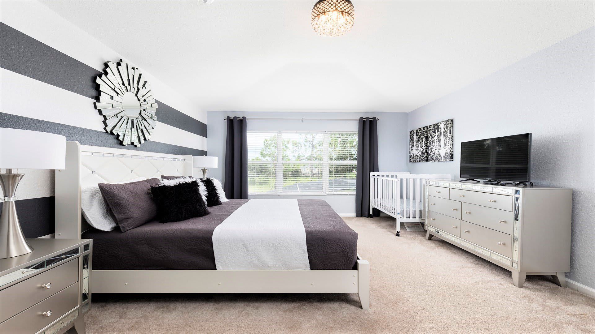 The master bedroom on the ground floor with a luxuriously large king bed