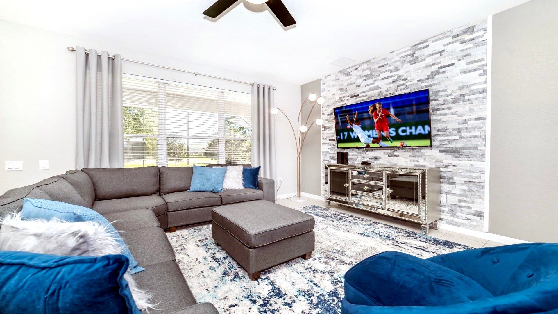 Stylish lounge with comfy seating and chic decor—ideal for movie nights and relaxation!