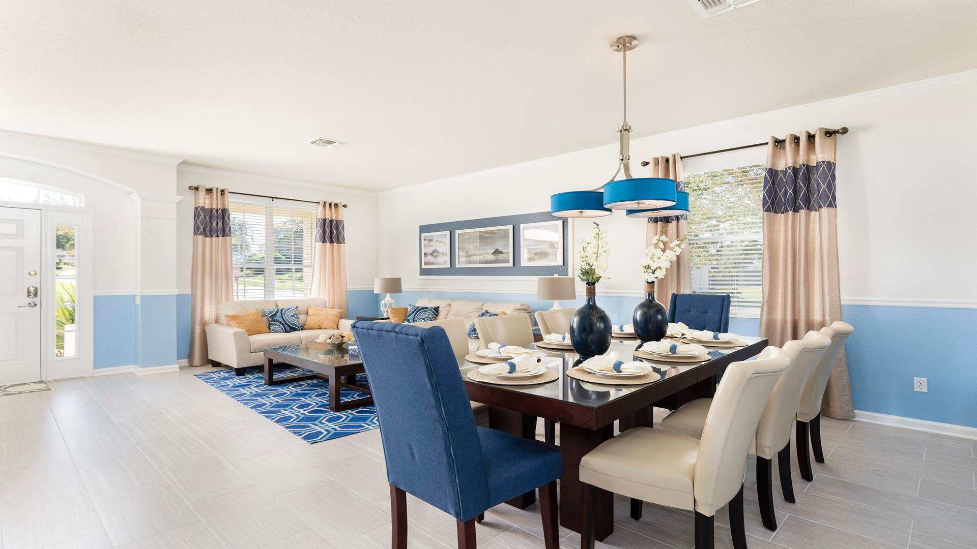 Eat, play, relax! This open-concept living space features a dining table for family meals and a comfy couch for movie nights.