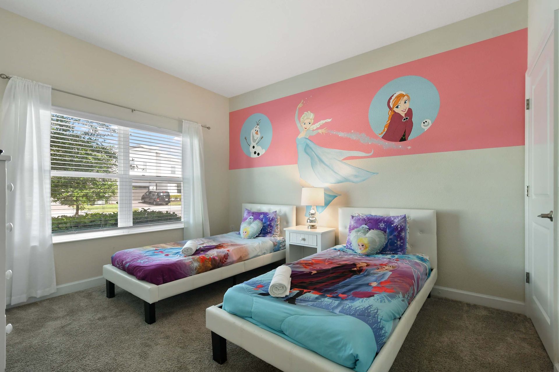 Enjoy the flexibility and comfort of our Elsa themed room with two twin beds, providing you with a wintry, cozy and restful retreat during your stay.