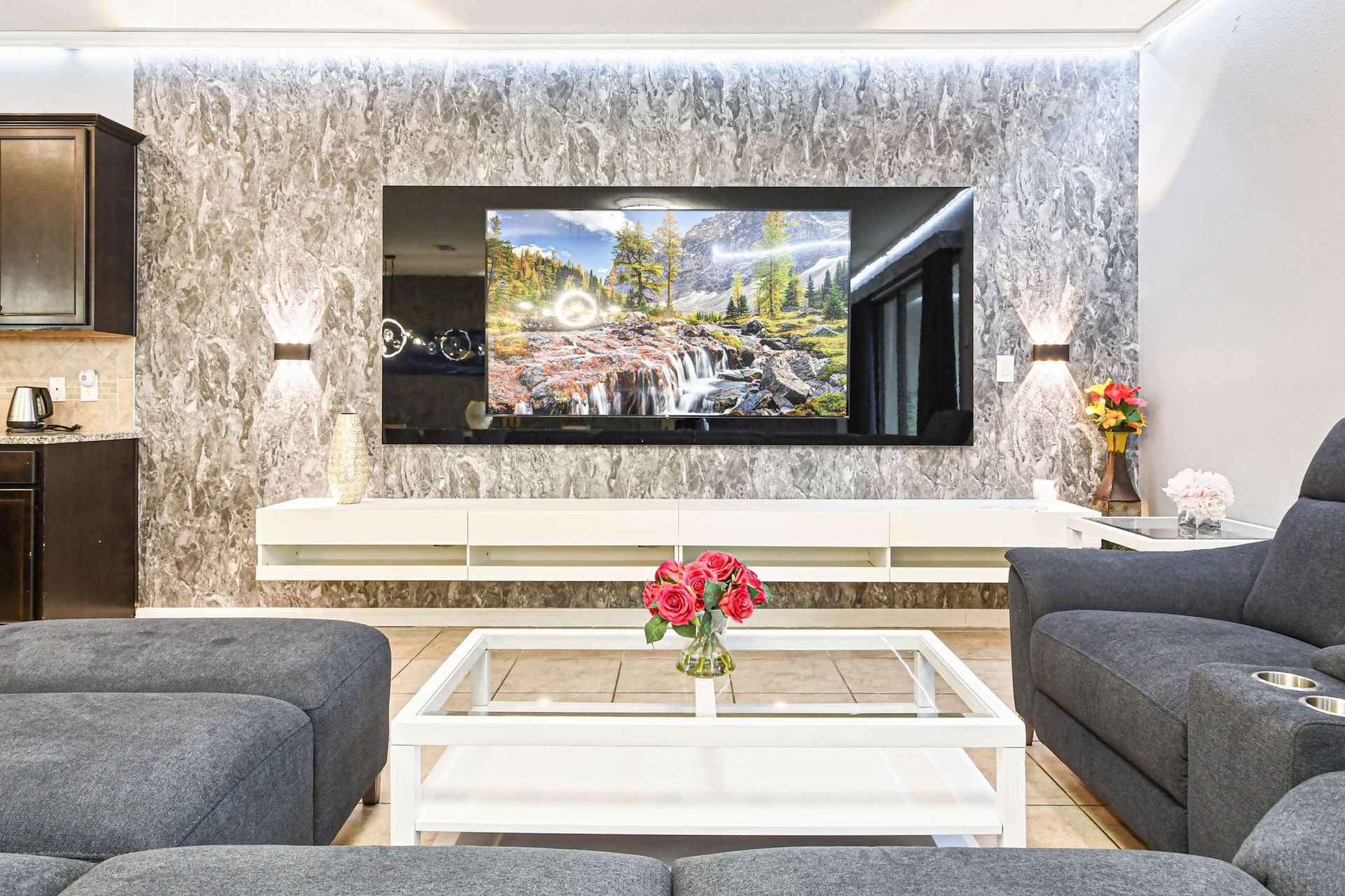 Modern living area with a stunning wall feature and cozy seating!