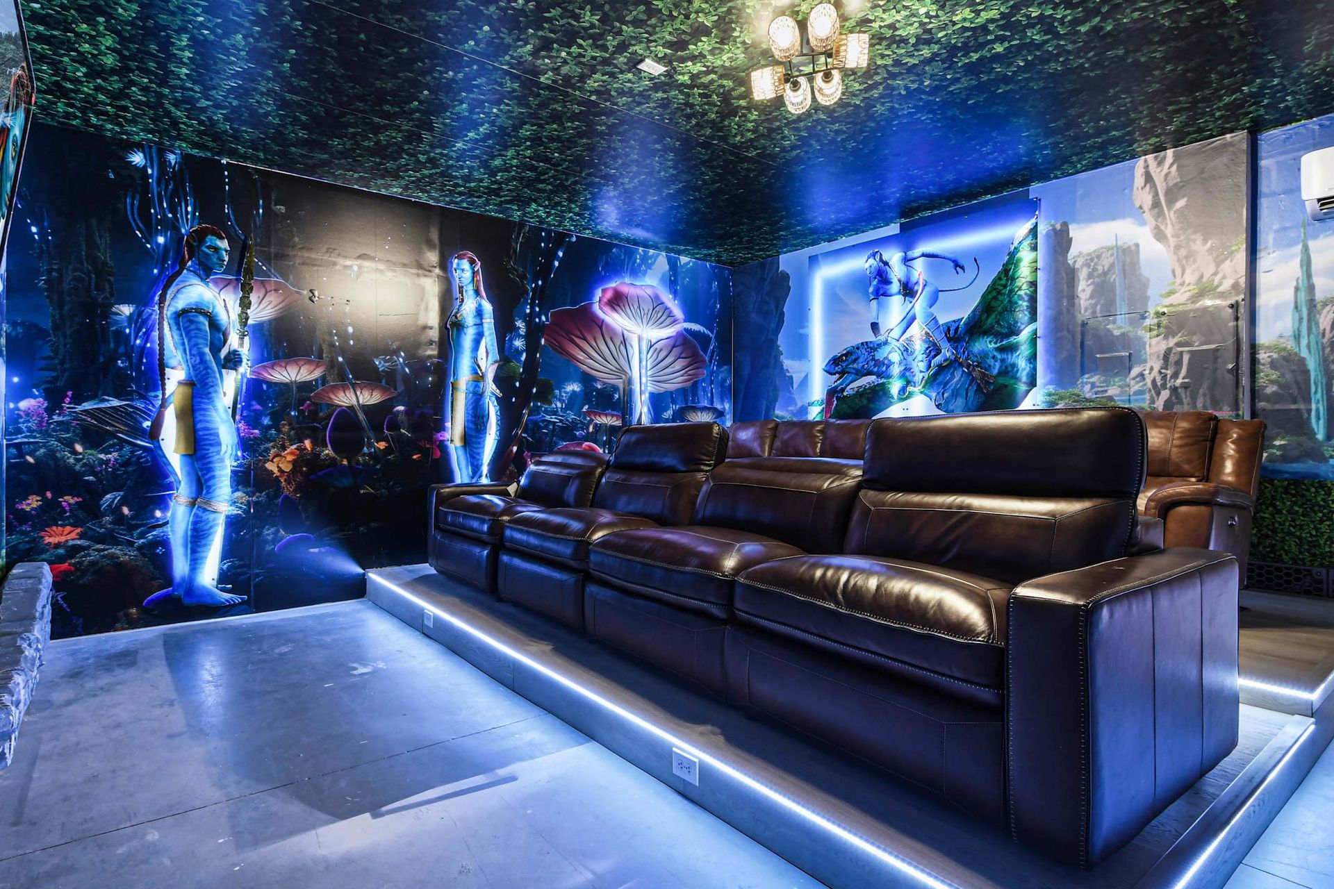 Immersive Avatar-themed theater with cozy recliners and vibrant decor!