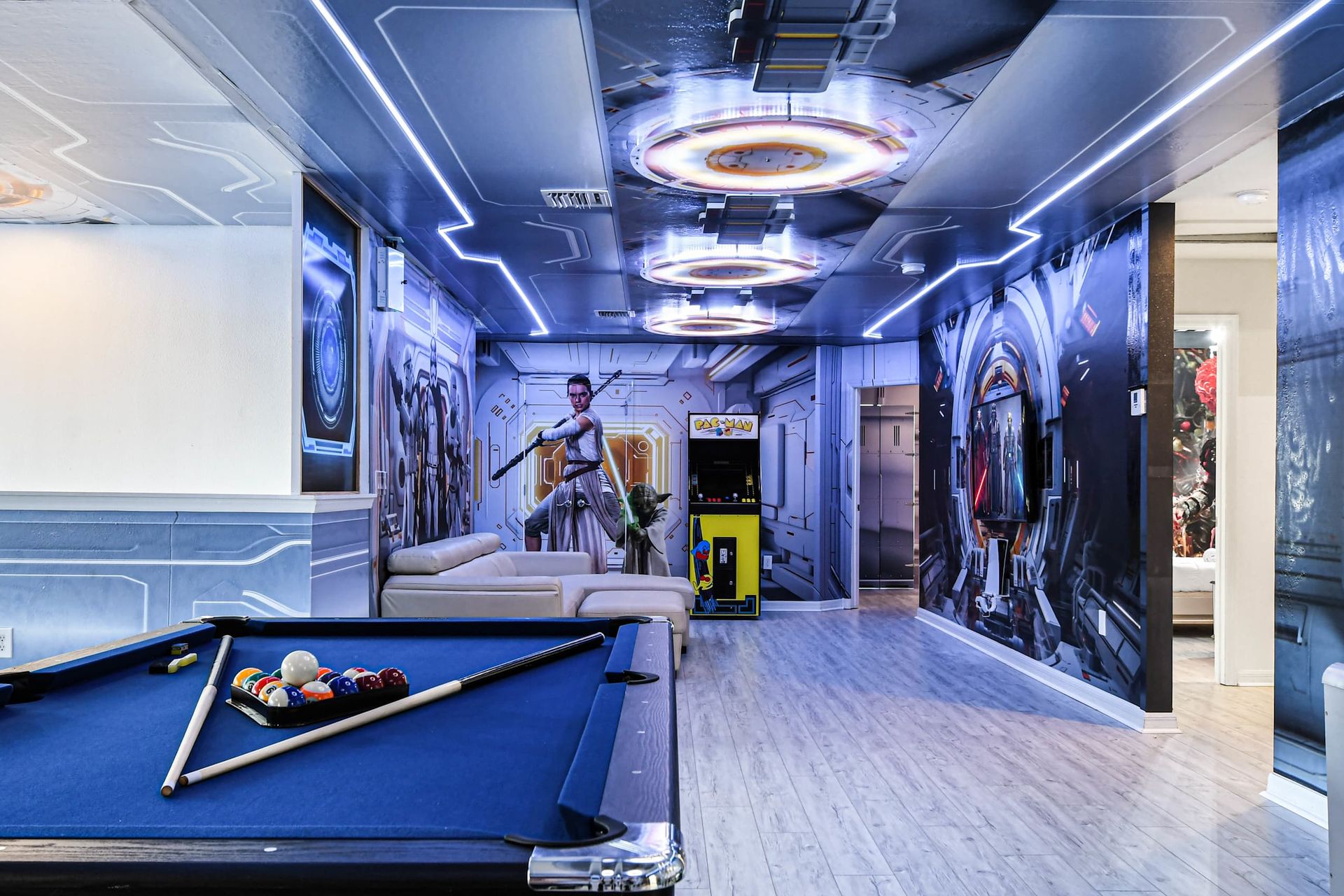 Star Wars-themed game room with pool, arcade, and galactic vibes!