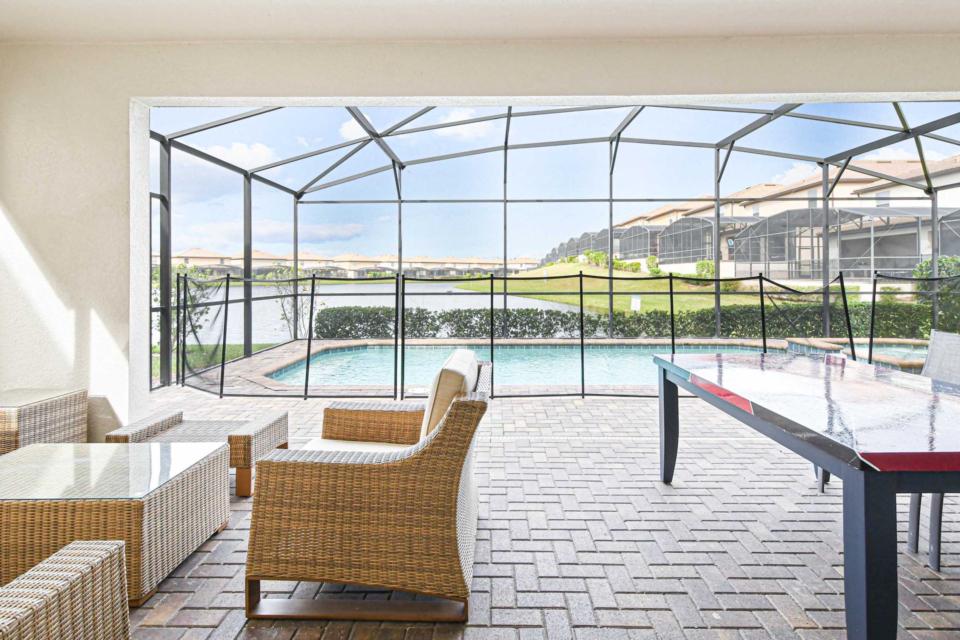 Covered patio with pool views, perfect for relaxing or poolside fun!