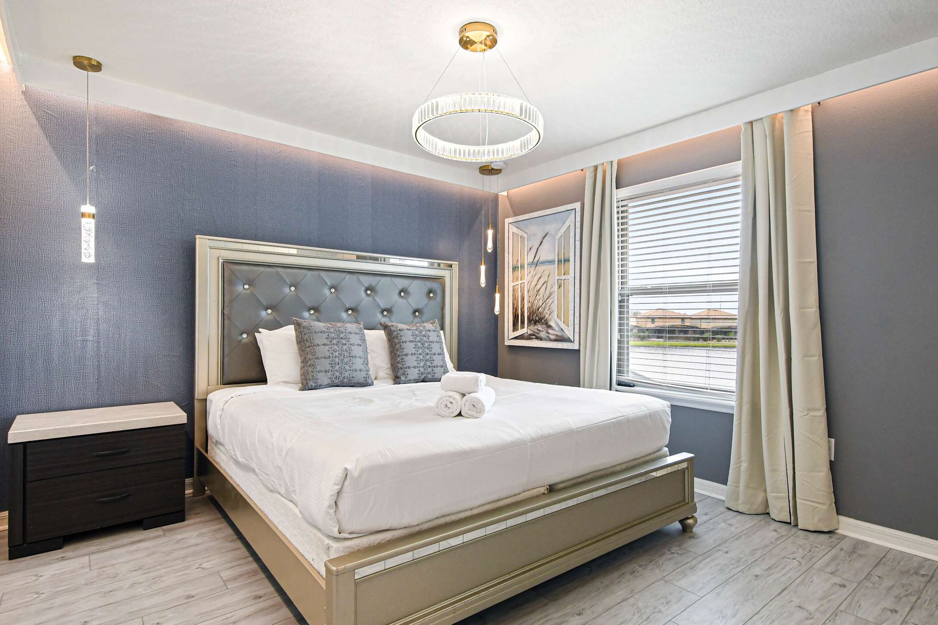 Modern and serene bedroom with luxurious touches and natural light!