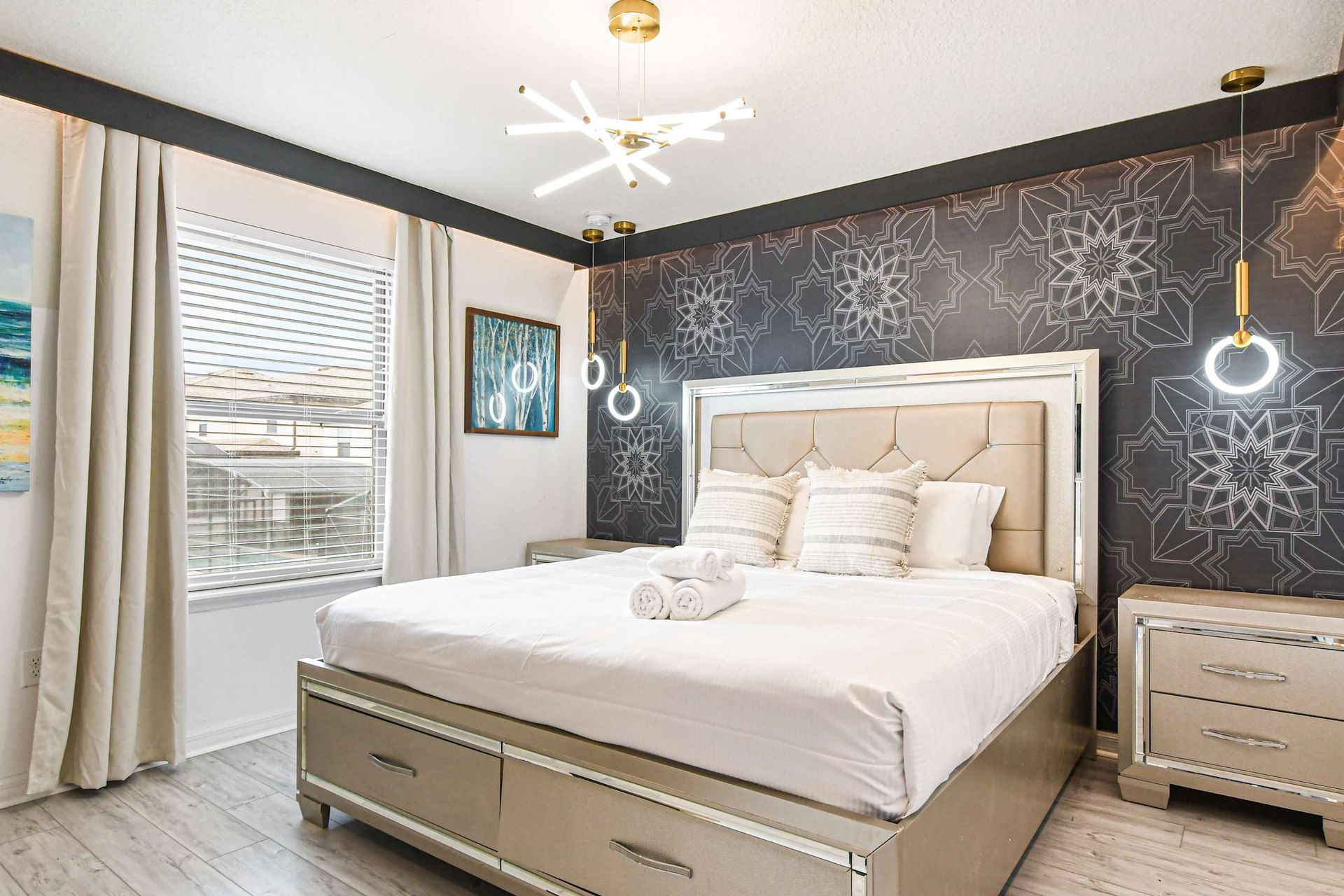 Chic bedroom with geometric accents and elegant modern lighting!