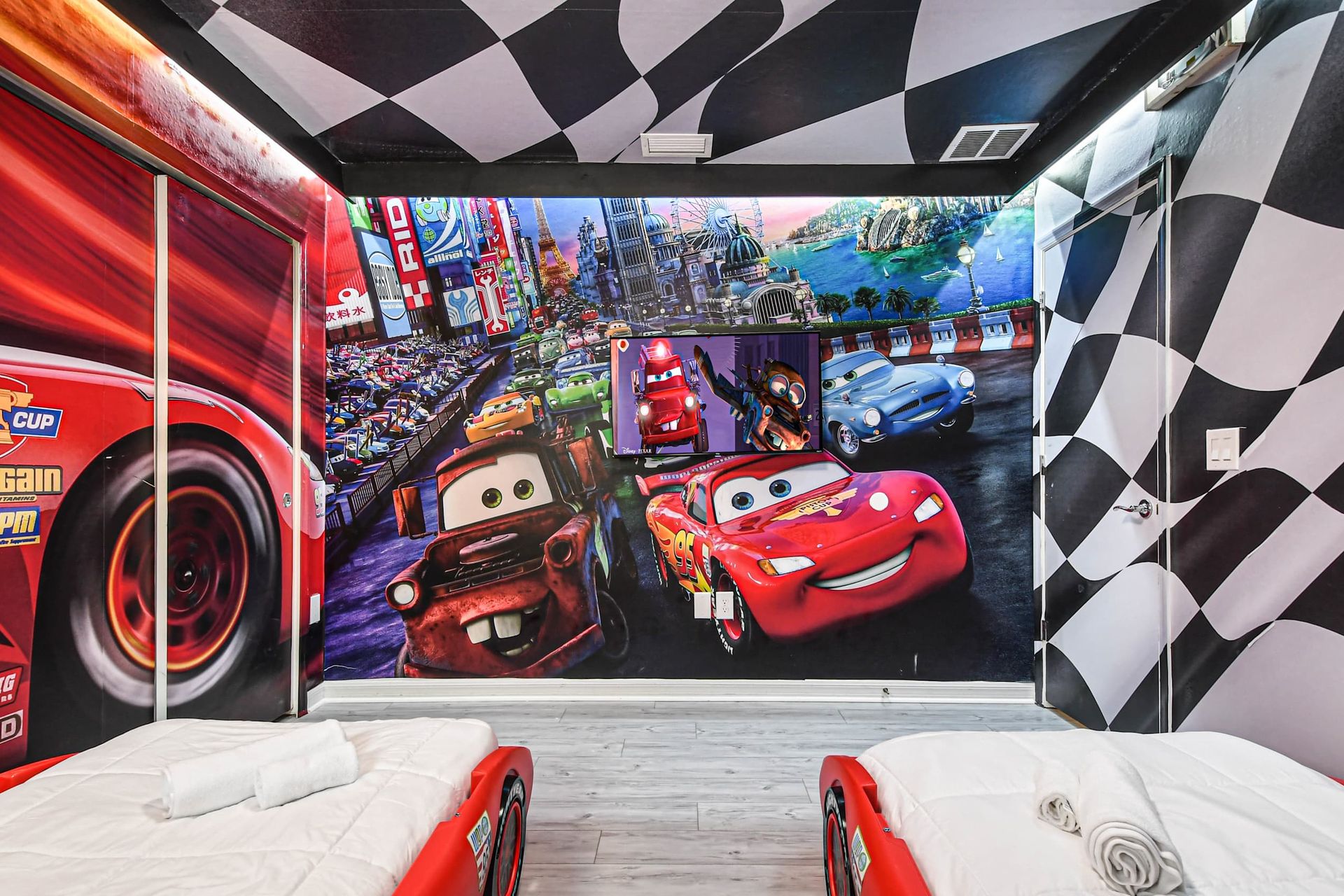 Cars-themed room with vibrant murals and race-ready vibes!